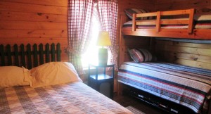 Beaver cabin comfortable double bed and bunk bed in Canaan Vermont