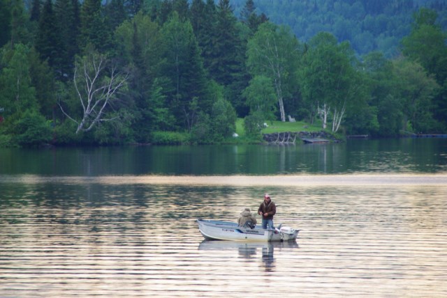Fishermen fishing on Lake Wallace in their boat at Jackson's Lodge